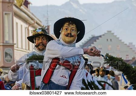 Stock Photo - "Schellenruhrer or """"Bell shakers"""", traditional carnival parade with historical masks and costumes, Murnau, Upper Bavaria, Bavaria, Germany, Europe". Fotosearch