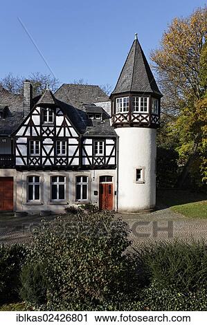 Stock Image - "Schloss Eller castle, half-timbered building and tower in the husbandry yard, Duesseldorf, North Rhine-Westphalia, Germany, Europe". Fotosearch