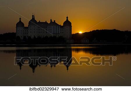 "Schloss Moritzburg"""" at sunset, a former castle to celebrate hunting, situated 10 km out of the City Dresden in the middle of beautiful forrests and lakes. Moritzburg, Germany, Europe" View Large Photo Image Stock Photo - "Schloss Moritzburg"""" at sunset, a former castle to celebrate hunting, situated 10 km out of the City Dresden in the middle of beautiful forrests and lakes. Moritzburg, Germany, Europe". Fotosearch