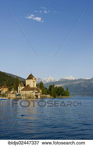 "Schloss Oberhofen castle on Lake Thun, Bernese Oberland with the mountains Moench, Eiger and Jungfrau at back, Bernese Oberland, Switzerland, Europe" View Large Photo Image Stock Photo - "Schloss Oberhofen castle on Lake Thun, Bernese Oberland with the mountains Moench, Eiger and Jungfrau at back, Bernese Oberland, Switzerland, Europe". Fotosearch