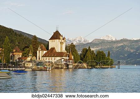 "Schloss Oberhofen Castle on Lake Thun, Bernese Oberland with the mountains Moench, Eiger and Jungfrau at back, Bernese Oberland, Switzerland, Europe" View Large Photo Image Stock Photo - "Schloss Oberhofen Castle on Lake Thun, Bernese Oberland with the mountains Moench, Eiger and Jungfrau at back, Bernese Oberland, Switzerland, Europe". Fotosearch