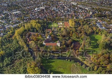 "Schloss Rheda Castle, Schlosspark Rheda Castle Gardens, red murky moat, Ems River, aerial view of Rheda-Wiedenbruck, Gutersloh district, Rheda, Rheda-Wiedenbruck, North Rhine-Westphalia, Germany, Europe" View Large Photo Image Stock Photo - "Schloss Rheda Castle, Schlosspark Rheda Castle Gardens, red murky moat, Ems River, aerial view of Rheda-Wiedenbruck, Gutersloh district, Rheda, Rheda-Wiedenbruck, North Rhine-Westphalia, Germany, Europe". Fotosearch