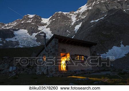 "Schmadrihuette mountain hut illuminated at dusk, in front of Gletscherhorn and Mittagshorn mountains, Lauterbrunnental, Canton of Bern, Switzerland, Europe" View Large Photo Image Stock Image - "Schmadrihuette mountain hut illuminated at dusk, in front of Gletscherhorn and Mittagshorn mountains, Lauterbrunnental, Canton of Bern, Switzerland, Europe". Fotosearch