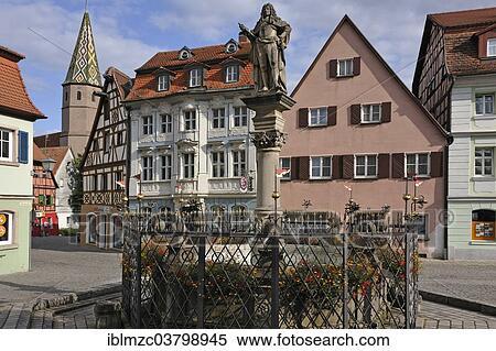 Stock Photography - "Schoner Brunnen fountain, 1572, with the statue of Emperor Charles VI., 1727, Weinmarkt square, Bad Windsheim, Middle Franconia, Bavaria, Germany, Europe". Fotosearch