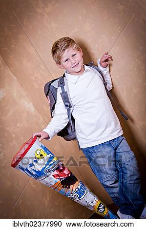 "School boy, first grader with a school bag and a school cone" View Large Photo Image Stock Image - "School boy, first grader with a school bag and a school cone". Fotosearch