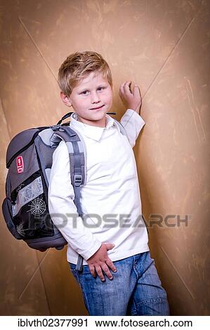 Stock Image - "School boy, first grader with a school bag". Fotosearch
