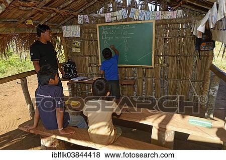 "School in a village of the Xavantes people, Tres Rios near the mission of Sangradouro, Primavera do Leste, Mato Grosso, Brazil, South America" View Large Photo Image Stock Photo - "School in a village of the Xavantes people, Tres Rios near the mission of Sangradouro, Primavera do Leste, Mato Grosso, Brazil, South America". Fotosearch