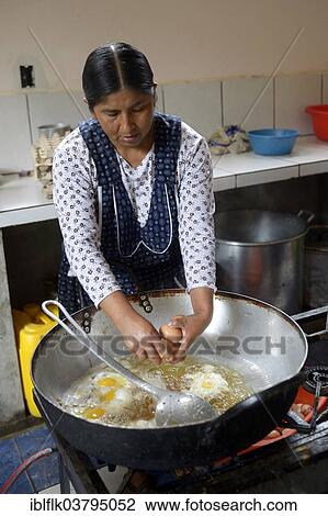 "School kitchen, cook preparing fried eggs, Carmen Pampa, Yungas, Department of La Paz, Bolivia, South America" View Large Photo Image Stock Image - "School kitchen, cook preparing fried eggs, Carmen Pampa, Yungas, Department of La Paz, Bolivia, South America". Fotosearch