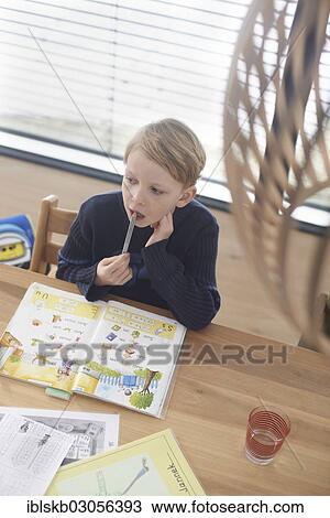 "Schoolboy, 7 years, doing his homework, Germany, Europe" View Large Photo Image Stock Image - "Schoolboy, 7 years, doing his homework, Germany, Europe". Fotosearch