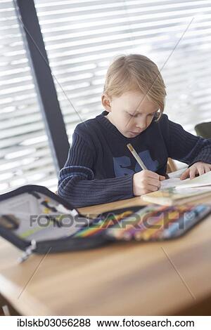Stock Photo - "Schoolboy, 7 years, doing his homework, Germany, Europe". Fotosearch