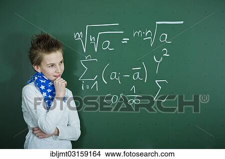 "Schoolboy pondering a mathematical formula on a school blackboard, Germany, Europe" View Large Photo Image Picture - "Schoolboy pondering a mathematical formula on a school blackboard, Germany, Europe". Fotosearch