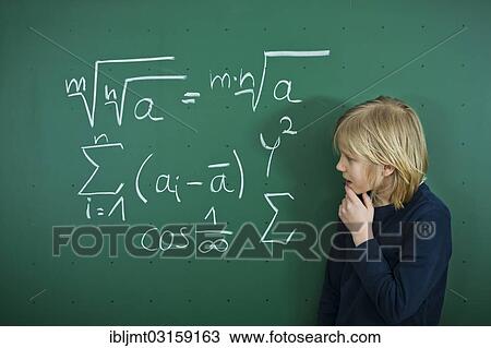 "Schoolboy pondering a mathematical formula on a school blackboard, Germany, Europe" View Large Photo Image Stock Image - "Schoolboy pondering a mathematical formula on a school blackboard, Germany, Europe". Fotosearch