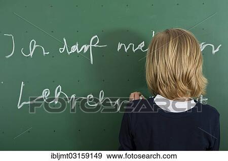 "Schoolboy writing on the blackboard as a penalty, Germany, Europe" View Large Photo Image Stock Photo - "Schoolboy writing on the blackboard as a penalty, Germany, Europe". Fotosearch