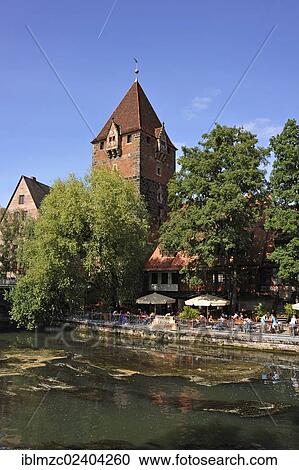 "Schuldturm tower, a former debtors' prison, built in 1323 on the bank of the Pegnitz river, beer garden, Insel Schuett 2, Nuremberg, Middle Franconia, Bavaria, Germany, Europe, PublicGround, Europe" View Large Photo Image Stock Image - "Schuldturm tower, a former debtors' prison, built in 1323 on the bank of the Pegnitz river, beer garden, Insel Schuett 2, Nuremberg, Middle Franconia, Bavaria, Germany, Europe, PublicGround, Europe". Fotosearch
