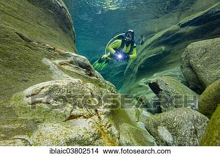 Picture - "Scuba diver in the Verzasca River, Lavertezzo, Valle Verzasca, Canton Ticino, Switzerland, Europe". Fotosearch