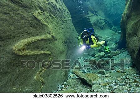 "Scuba diver in the Verzasca River, Lavertezzo, Valle Verzasca, Canton Ticino, Switzerland, Europe" View Large Photo Image Stock Photograph - "Scuba diver in the Verzasca River, Lavertezzo, Valle Verzasca, Canton Ticino, Switzerland, Europe". Fotosearch