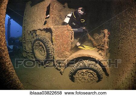 "Scuba diver looking at truck on shipwreck """"SS Thistlegorm"""", Red Sea, Egypt, Africa" View Large Photo Image Stock Photo - "Scuba diver looking at truck on shipwreck """"SS Thistlegorm"""", Red Sea, Egypt, Africa". Fotosearch
