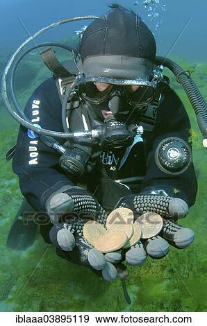 "Scuba diver presenting some underwater treasure, Russian coins from the era of Empress Ekaterina II., Lake Baikal, Siberia, Russia, Europe" View Large Photo Image Stock Photo - "Scuba diver presenting some underwater treasure, Russian coins from the era of Empress Ekaterina II., Lake Baikal, Siberia, Russia, Europe". Fotosearch