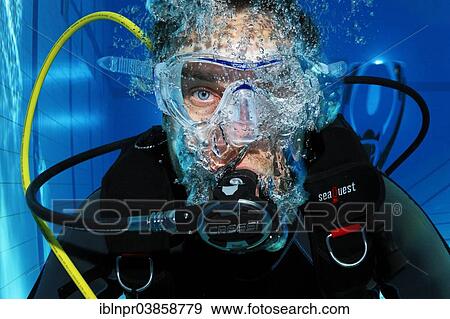 "Scuba diver with air bubbles, portrait, in a swimming pool, Nuremberg, Bavaria, Germany, Europe" View Large Photo Image Stock Photo - "Scuba diver with air bubbles, portrait, in a swimming pool, Nuremberg, Bavaria, Germany, Europe". Fotosearch