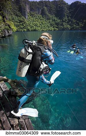 "Scuba divers at Barracuda Lake, Coron Nature Reserve, Mimaropa, Philippines, Asia" View Large Photo Image Stock Photo - "Scuba divers at Barracuda Lake, Coron Nature Reserve, Mimaropa, Philippines, Asia". Fotosearch