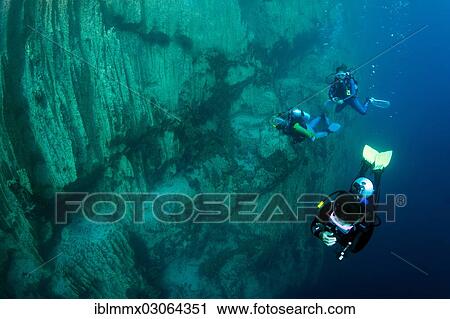 Stock Image - "Scuba divers in Barracuda Lake, Bancuan, Naturschutzgebiet Coron, Calamian Islands, Palawan, Mimaropa, Philippines, Asia". Fotosearch
