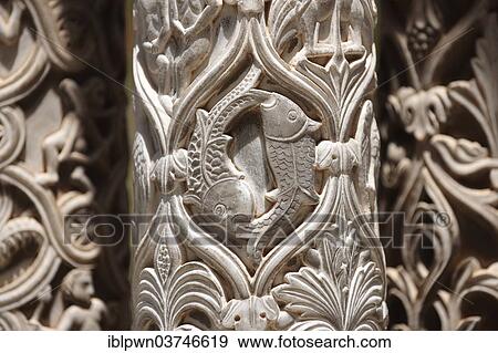 Stock Photo - "Sculpted Christian fish symbols in the medieval columns of the cloisters of Monreale Cathedral, Palermo, Sicily, Italy, Europe". Fotosearch