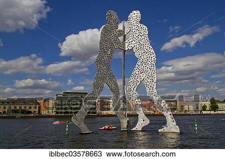 "Sculpture """"Molecule Man"""" on the Spree River, Berlin, Berlin, Germany, Europe" View Large Photo Image Stock Image - "Sculpture """"Molecule Man"""" on the Spree River, Berlin, Berlin, Germany, Europe". Fotosearch