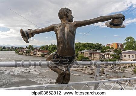 Stock Image - "Sculpture of a boy holding two hats, on White Bridge or Tetrikhidi, Kutaissi, Imereti region, Georgia, Asia". Fotosearch