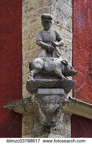 "Sculpture of a butcher and pig at a butcher shop, Rothenburg ob der Tauber, Middle Franconia, Bavaria, Germany, Europe" View Large Photo Image Stock Photo - "Sculpture of a butcher and pig at a butcher shop, Rothenburg ob der Tauber, Middle Franconia, Bavaria, Germany, Europe". Fotosearch