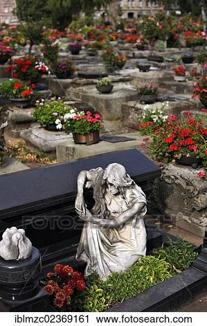 "Sculpture of a mourner at a sarcophagus in front of other graves with flowers, St. John's Cemetery, Nuremberg, Middle Franconia, Bavaria, Germany, Europe" View Large Photo Image Stock Image - "Sculpture of a mourner at a sarcophagus in front of other graves with flowers, St. John's Cemetery, Nuremberg, Middle Franconia, Bavaria, Germany, Europe". Fotosearch