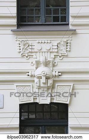 "Sculpture of a warrior's helmet, Art Nouveau entrance of the house Strelnieku iela 12, architect Mikhail Eisenstein, Riga, Latvia, Europe" View Large Photo Image Stock Photo - "Sculpture of a warrior's helmet, Art Nouveau entrance of the house Strelnieku iela 12, architect Mikhail Eisenstein, Riga, Latvia, Europe". Fotosearch