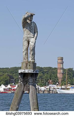 "Sculpture of Fiete, the last sailor of the sailing ship Passat, old lighthouse, Priwall, Travemunde, Schleswig-Holstein, Germany, Europe" View Large Photo Image Stock Image - "Sculpture of Fiete, the last sailor of the sailing ship Passat, old lighthouse, Priwall, Travemunde, Schleswig-Holstein, Germany, Europe". Fotosearch