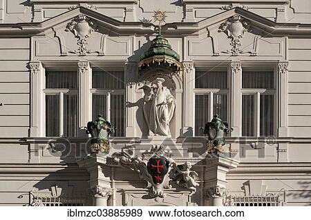 Stock Photo - "Sculpture with a baldachin or canopy and a red star above the entrance portal of the building of the """"Knightly Order of Knights of the Cross with the Red Star"""", Vienna, Vienna State, Austria, Europe". Fotosearch
