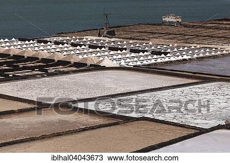 "Sea salt production, salt pans, Salinas de Janubio, Lanzarote, Canary Islands, Spain, Europe" View Large Photo Image Stock Image - "Sea salt production, salt pans, Salinas de Janubio, Lanzarote, Canary Islands, Spain, Europe". Fotosearch