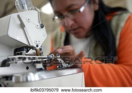 "Seamstress working on a sewing machine, El Alto, Departamento La Paz, Bolivia, South America" View Large Photo Image Stock Photo - "Seamstress working on a sewing machine, El Alto, Departamento La Paz, Bolivia, South America". Fotosearch