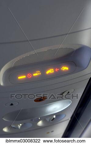 "Seatbelt and non-smoking-indicator on an airplane, in flight" View Large Photo Image Stock Image - "Seatbelt and non-smoking-indicator on an airplane, in flight". Fotosearch