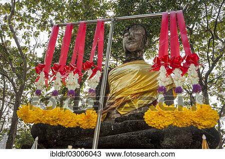 "Seated Buddha statue, floral garlands, Buddhist sacrifices, temple complex of Wat Khao Phanom Phloeng, Si Satchanalai Historical Park, UNESCO World Heritage Site, Si Satchanalai, Sukhothai Province, Northern Thailand, Thailand, Asia" View Large Photo Image Stock Image - "Seated Buddha statue, floral garlands, Buddhist sacrifices, temple complex of Wat Khao Phanom Phloeng, Si Satchanalai Historical Park, UNESCO World Heritage Site, Si Satchanalai, Sukhothai Province, Northern Thailand, Thailand, Asia". Fotosearch