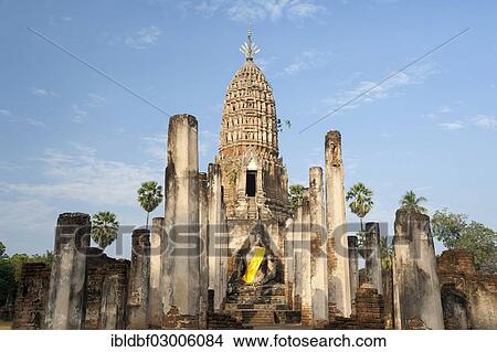 Picture - "Seated Buddha statue in front of a chedi, temple complex of Wat Phra Si Rattana Mahathat Chaliang, Si Satchanalai Historical Park, UNESCO World Heritage Site, Si Satchanalai, Sukhothai Province, Northern Thailand, Thailand, Asia". Fotosearch
