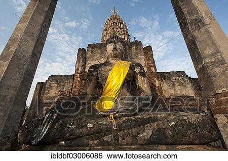 "Seated Buddha statue in front of a chedi, temple complex of Wat Phra Si Rattana Mahathat Chaliang, Si Satchanalai Historical Park, UNESCO World Heritage Site, Si Satchanalai, Sukhothai Province, Northern Thailand, Thailand, Asia" View Large Photo Image Stock Photograph - "Seated Buddha statue in front of a chedi, temple complex of Wat Phra Si Rattana Mahathat Chaliang, Si Satchanalai Historical Park, UNESCO World Heritage Site, Si Satchanalai, Sukhothai Province, Northern Thailand, Thailand, Asia". Fotosearch