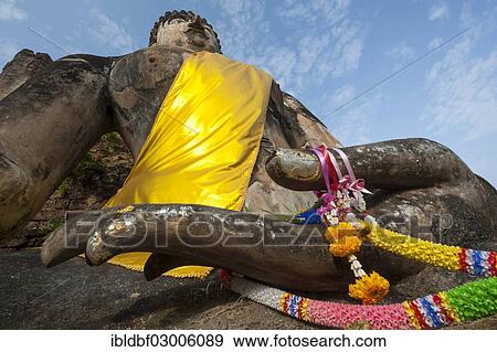 Stock Photo - "Seated Buddha statue, temple complex of Wat Phra Si Rattana Mahathat Chaliang, Si Satchanalai Historical Park, UNESCO World Heritage Site, Si Satchanalai, Sukhothai Province, Northern Thailand, Thailand, Asia". Fotosearch