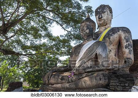 Stock Image - "Seated Buddha, two statues, temple complex of Wat Phra Si Rattana Mahathat Chaliang, Si Satchanalai Historical Park, UNESCO World Heritage Site, Si Satchanalai, Sukhothai Province, Northern Thailand, Thailand, Asia". Fotosearch