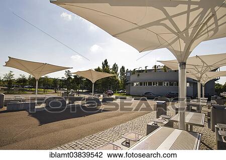 "Seating and umbrellas in front of the Central Institute of Medical Engineering TUM, site of the Ludwig Maximilian University of Munich, LMU Garching Campus, Garching bei Munchen, Upper Bavaria, Bavaria, Germany, Europe" View Large Photo Image Stock Image - "Seating and umbrellas in front of the Central Institute of Medical Engineering TUM, site of the Ludwig Maximilian University of Munich, LMU Garching Campus, Garching bei Munchen, Upper Bavaria, Bavaria, Germany, Europe". Fotosearch