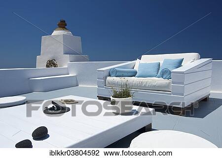 Stock Image - "Seating furniture on a patio, Imerovigli, Santorini, Cyclades, Greece, Europe". Fotosearch