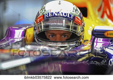 Stock Image - "Sebastian Vettel, GER, Red Bull Racing, sitting in the cockpit of his race car wearing a helmet during the Friday practice for the Spanish Grand Prix, Formula 1 race at the Circuit de Catalunya, Montmelo, Catalonia, Spain, Europe". Fotosearch