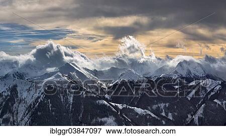 Stock Photo - "Seckau Alps, Niedere Tauern mountain range, on the left, Himmeleck mountain, on the left, and Grosser Griesstein, on the right, rain clouds approaching, seen from Blaseneckgipfel mountain in the Eisenerzer Alpen mountains, Styria, Austria, Europe". Fotosearch