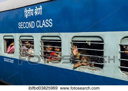 "Second class Indian Railways train coach, passengers looking out of the barred windows, Bhavnagar, Gujarat, India, Asia" View Large Photo Image Stock Photo - "Second class Indian Railways train coach, passengers looking out of the barred windows, Bhavnagar, Gujarat, India, Asia". Fotosearch