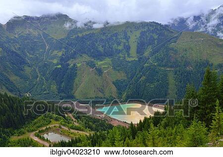 "Sedimentation pool, sludge pond in the mining area of ​​the open pit mine, Erzberg mountain at Eisenerz, Styria, Austria, Europe" View Large Photo Image Stock Image - "Sedimentation pool, sludge pond in the mining area of ​​the open pit mine, Erzberg mountain at Eisenerz, Styria, Austria, Europe". Fotosearch