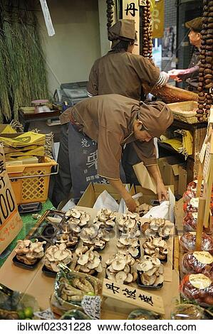 Stock Photo - "Seller offering matsutake, pine mushrooms (Tricholoma matsutake), very expensive mushrooms, Nishiki Market, Kyoto, Japan, East Asia, Asia". Fotosearch