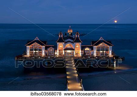 "Sellin Pier with the rising moon, Baltic Seaside Resort Sellin, Rugen, Mecklenburg-Western Pomerania, Germany, Europe" View Large Photo Image Stock Photo - "Sellin Pier with the rising moon, Baltic Seaside Resort Sellin, Rugen, Mecklenburg-Western Pomerania, Germany, Europe". Fotosearch