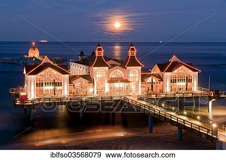 "Sellin Pier with the rising moon, Baltic Seaside Resort Sellin, Rugen, Mecklenburg-Western Pomerania, Germany, Europe" View Large Photo Image Stock Photo - "Sellin Pier with the rising moon, Baltic Seaside Resort Sellin, Rugen, Mecklenburg-Western Pomerania, Germany, Europe". Fotosearch